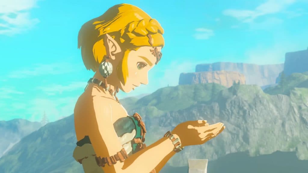 Zelda looking down at her hands 