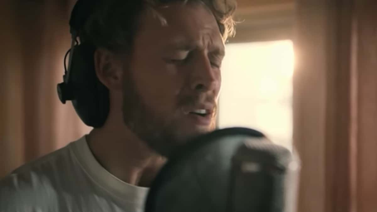 A close up of Christopher Lund Nissen singing in A Beautiful Life