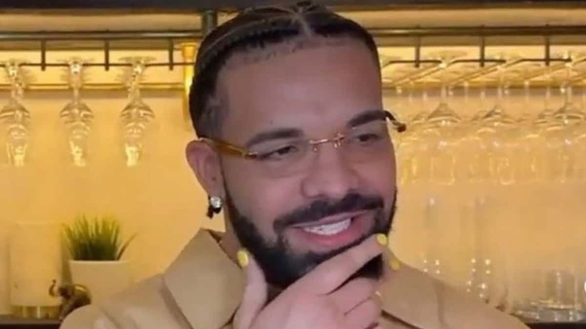 Drake in brown shirt looking at camera while on stream