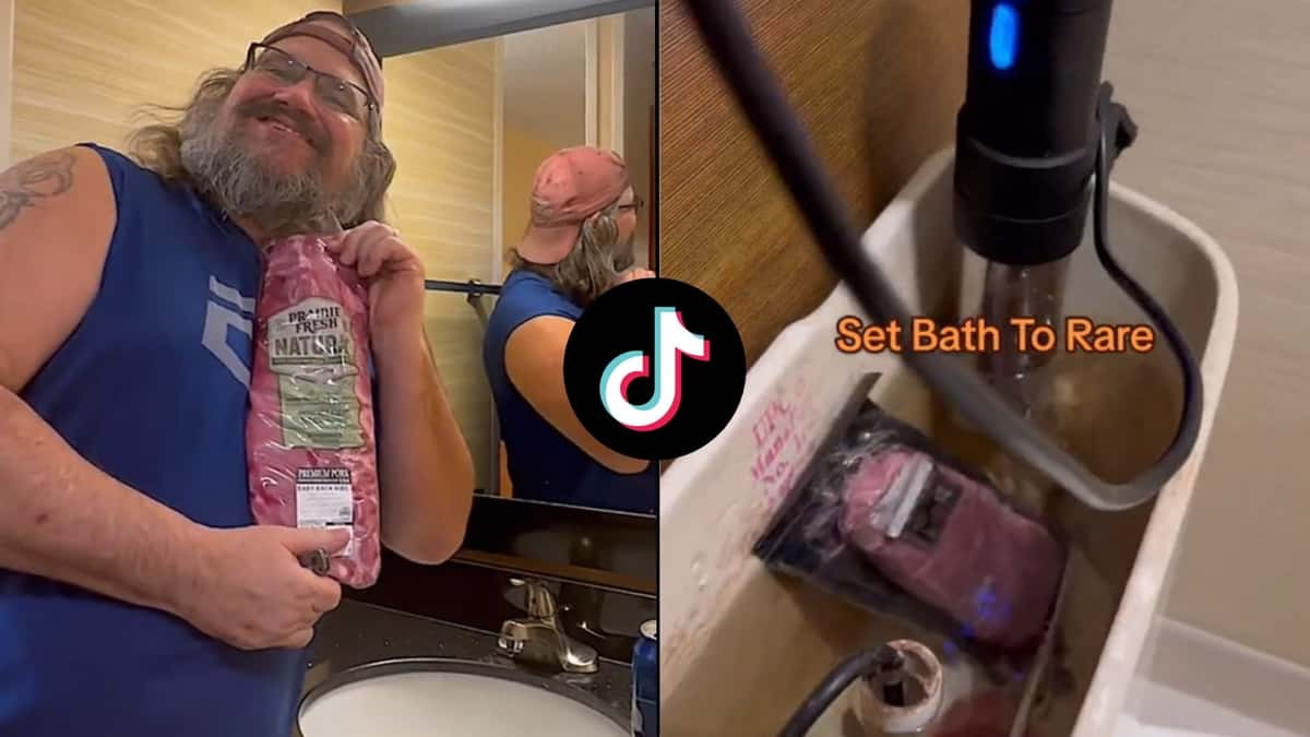 Man holding meat in hotel bathroom