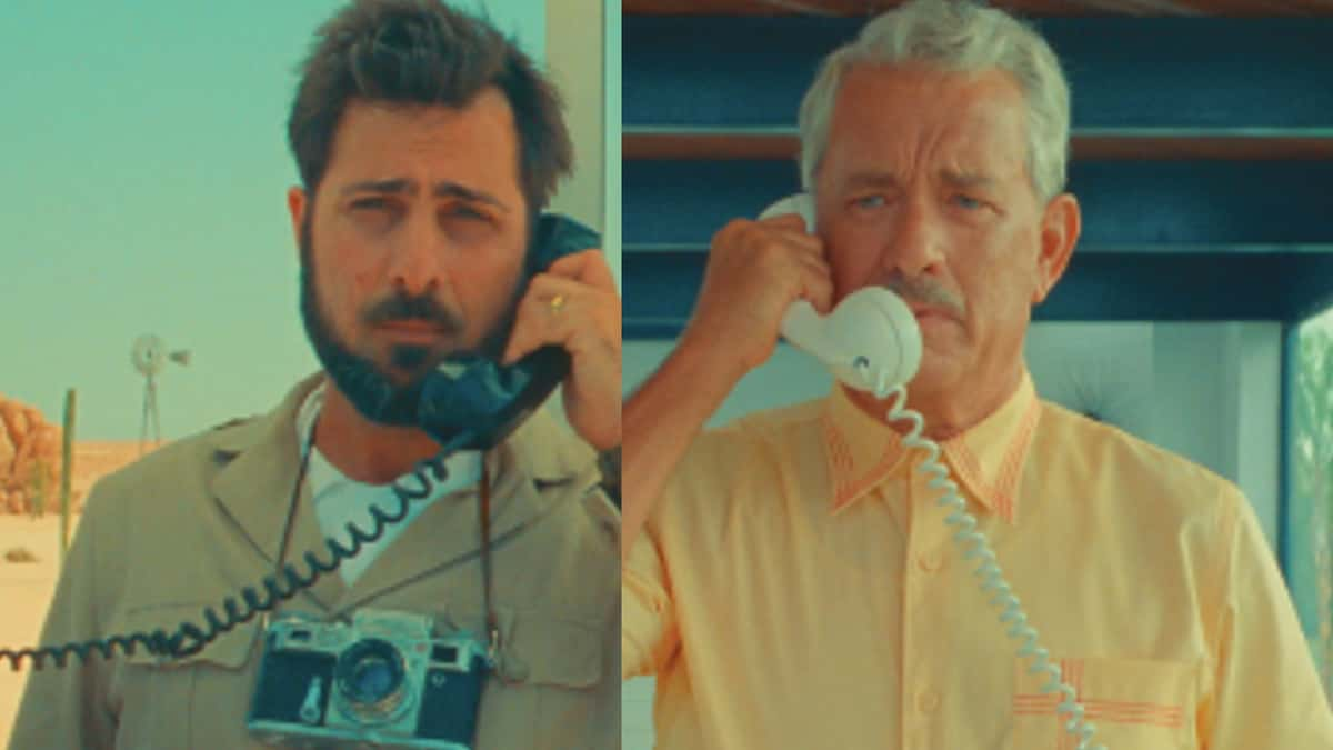 Jason Schwartzman and Tom Hanks talk on a landline phone in Asteroid City