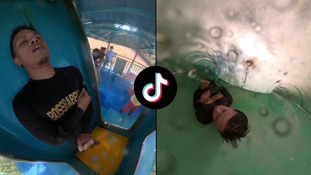 Man in water slide getting stuck around water