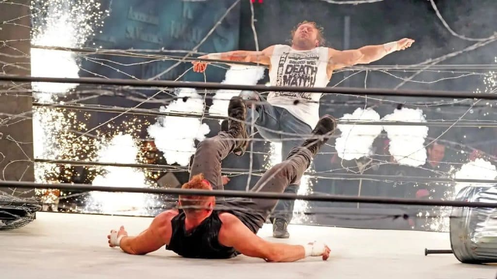 jon moxley kicking kenny omega into ropes in AEW