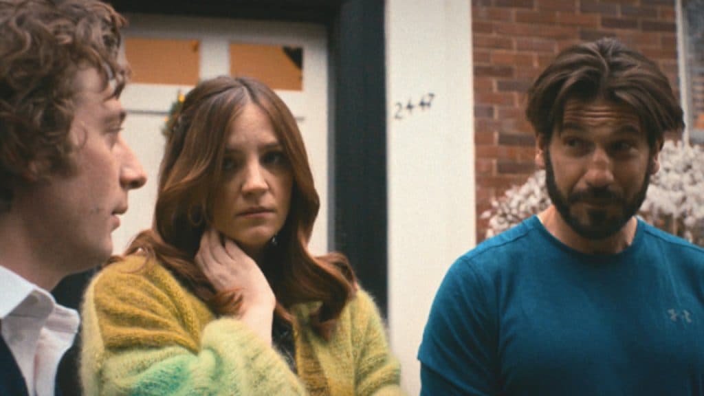 Carmy, Mikey, and Syd stand outside of their childhood home in The Bear