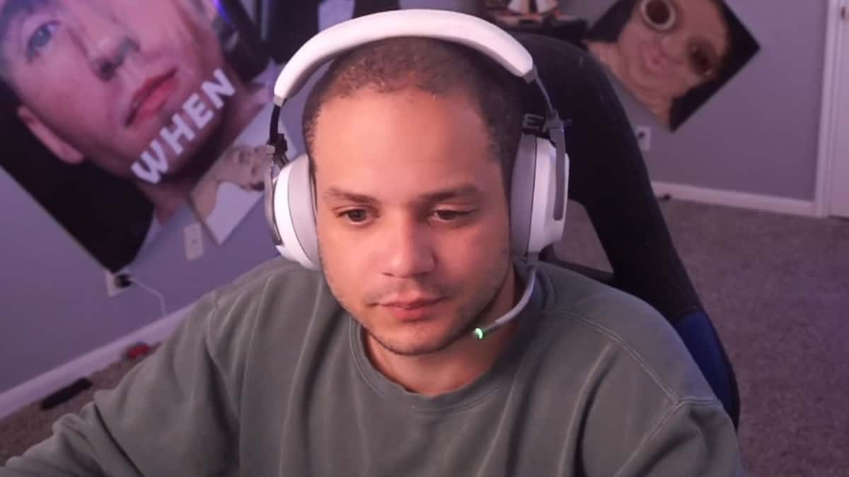 Twitch streamer erobb221 sat at desk wearing white gaming headset