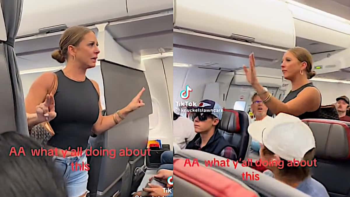 Woman giving a speech in the middle of an airplane's alley