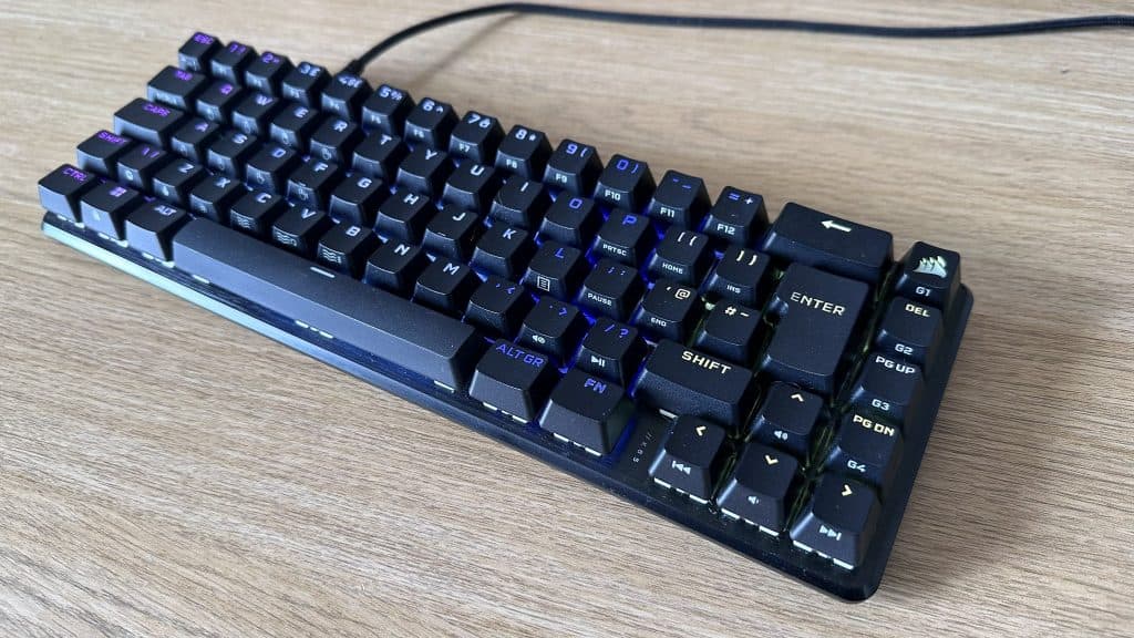 Corsair K65 Pro Mini design on a desk plugged in