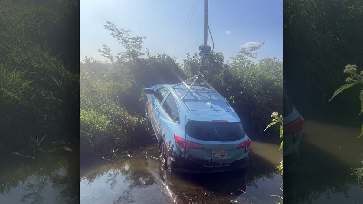 A google Street View car in a ditch