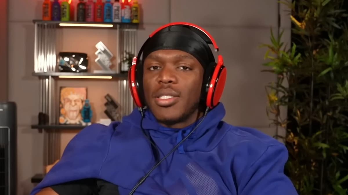 KSI sat at desk wearing blue hoodie