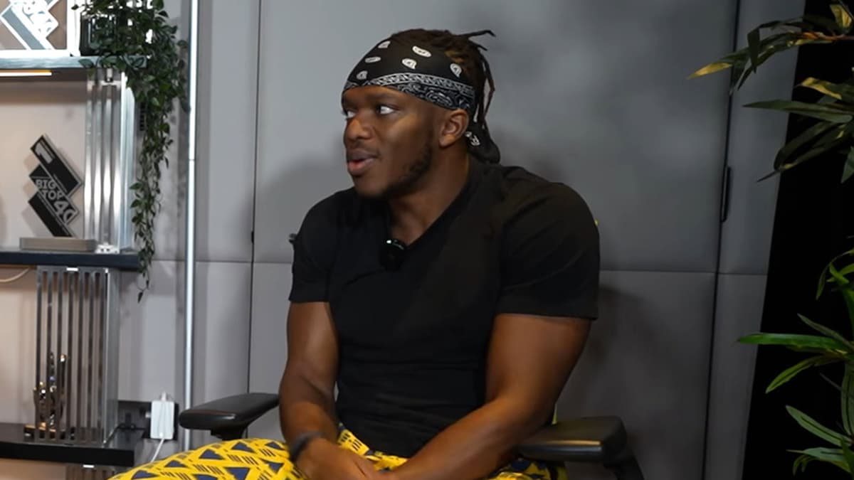 KSI sat on chair in his office