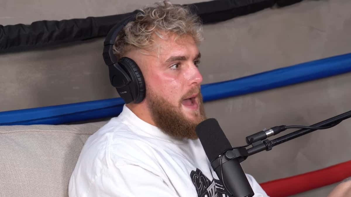 Jake Paul in white shirt talking to microphone