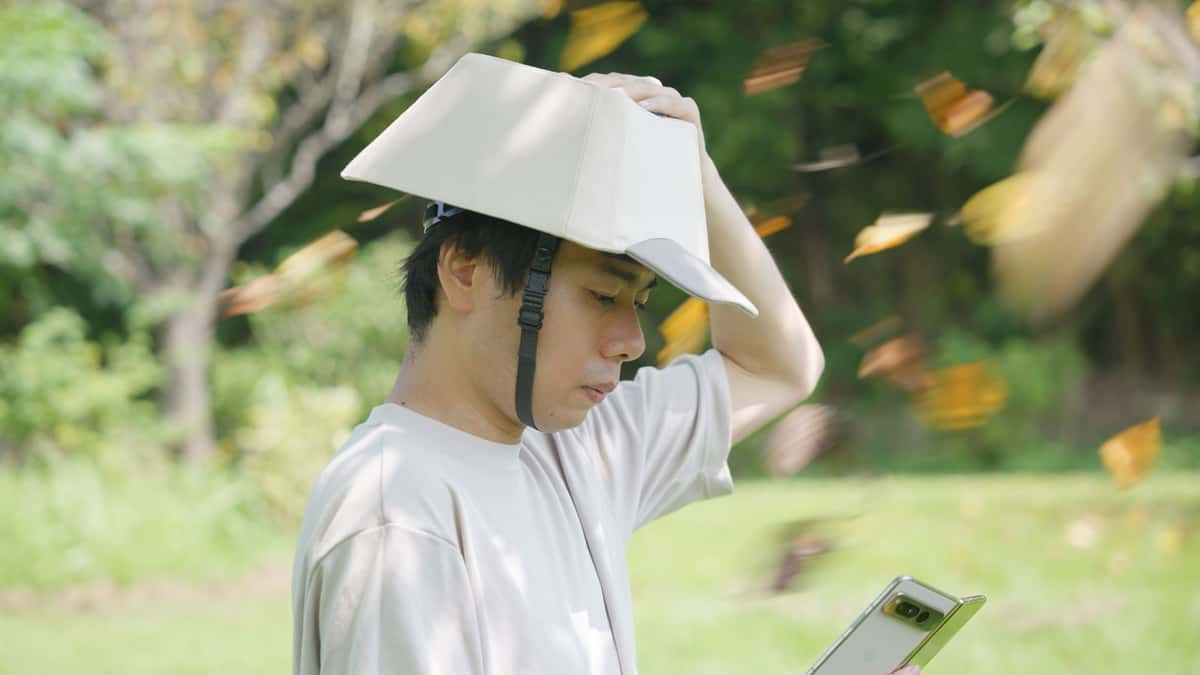 Man wearing weird google keycap hat