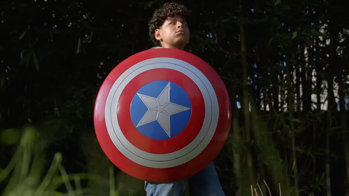 A image of MTG Marvel Header Boy holding Captain America's shield.