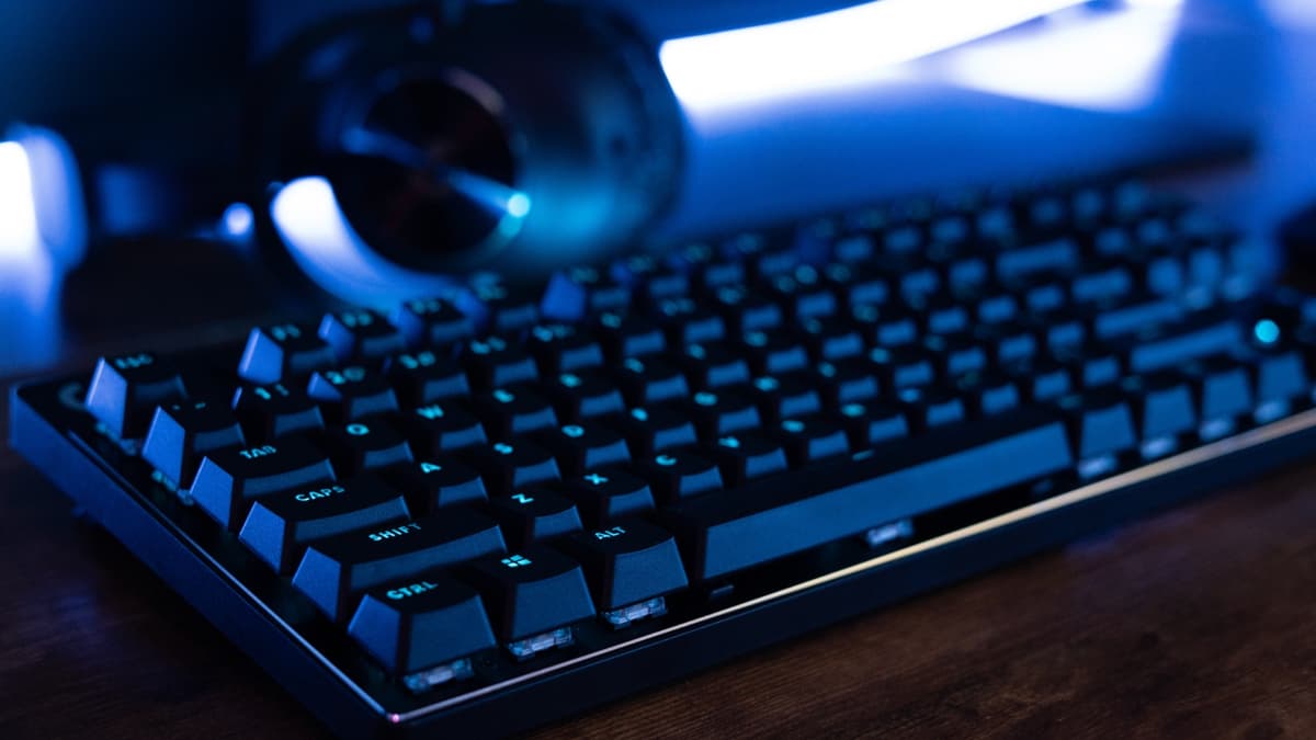 Logitech G Pro X TKL Lightspeed on a desk with blue lighting