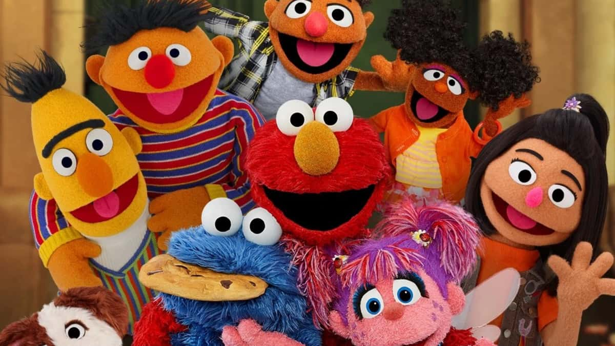 Elmo, Cookie Monster, and the characters of Sesame Street