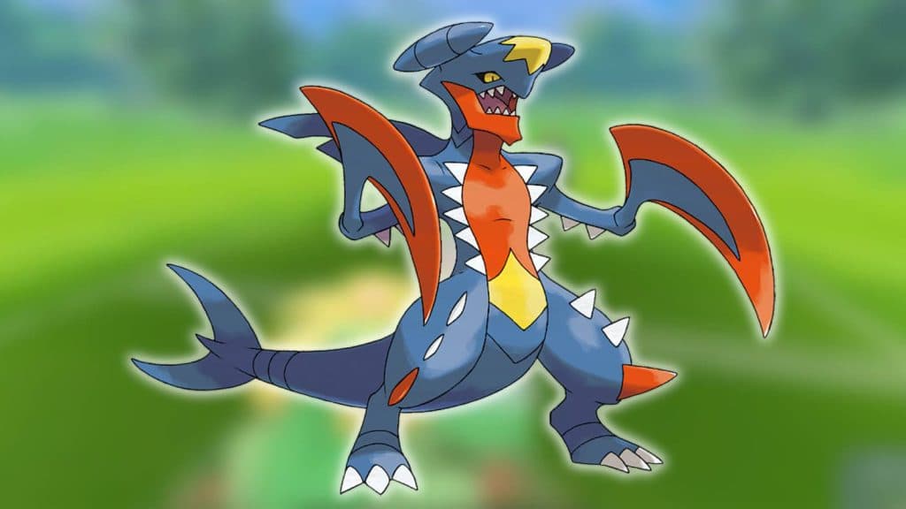 Mega Garchomp appears against a blurred background