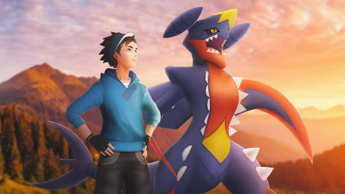 Pokemon Go key art shows a Mega Garchomp and a Pokemon trainer