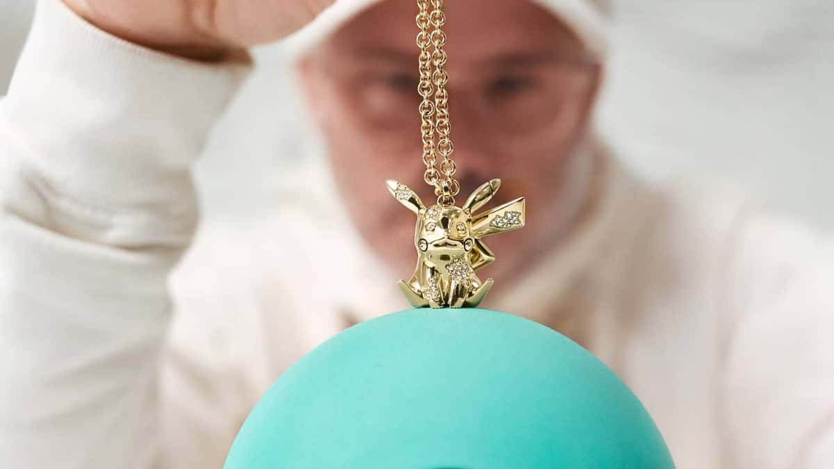 Artist Daniel Arsham holds a diamond Pikachu pendant