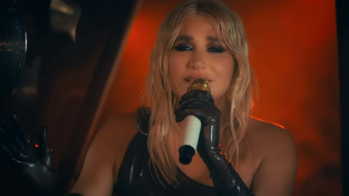 Kesha performing and looking at the camera