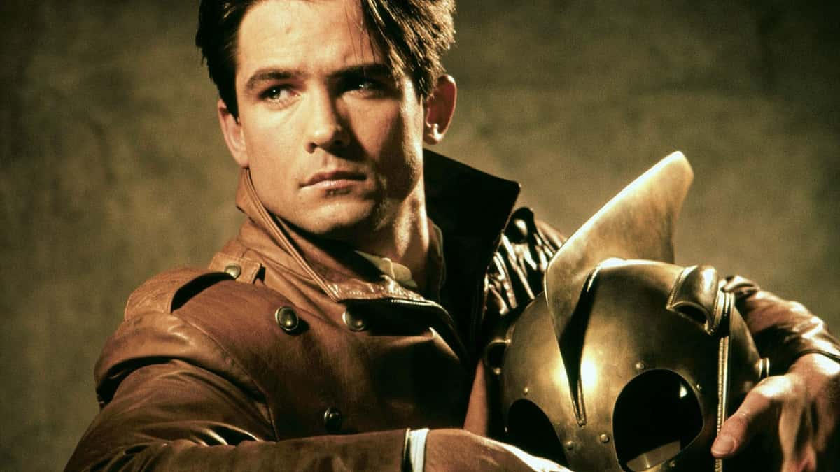 Billy Campbell holding his Rocketeer helmet.