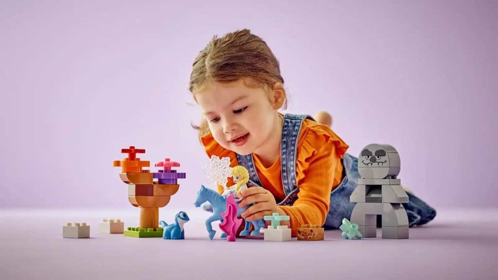 A child playing with their new Disney-inspired LEGO Duplo Elsa & Bruni in the Enchanted Forest set