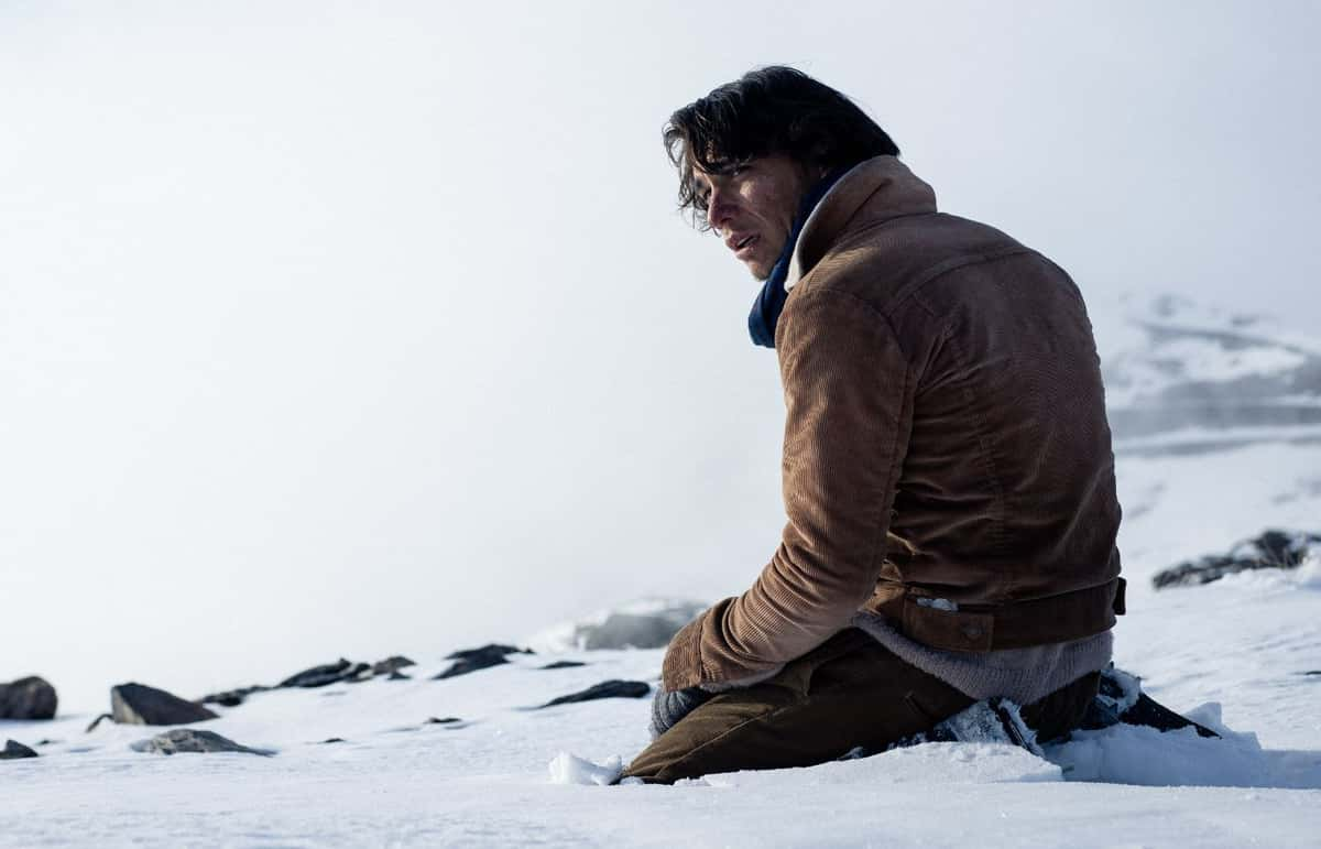 A man on a mountain top in Netflix's Society of the Snow