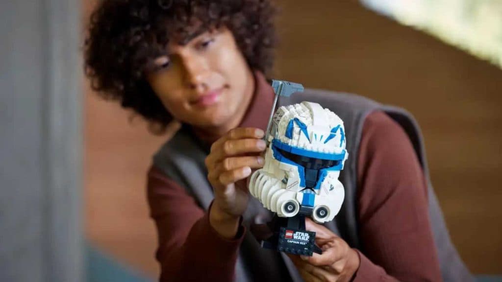 An adult aged 18 and up admiring their LEGO Star Wars Captain Rex Helmet