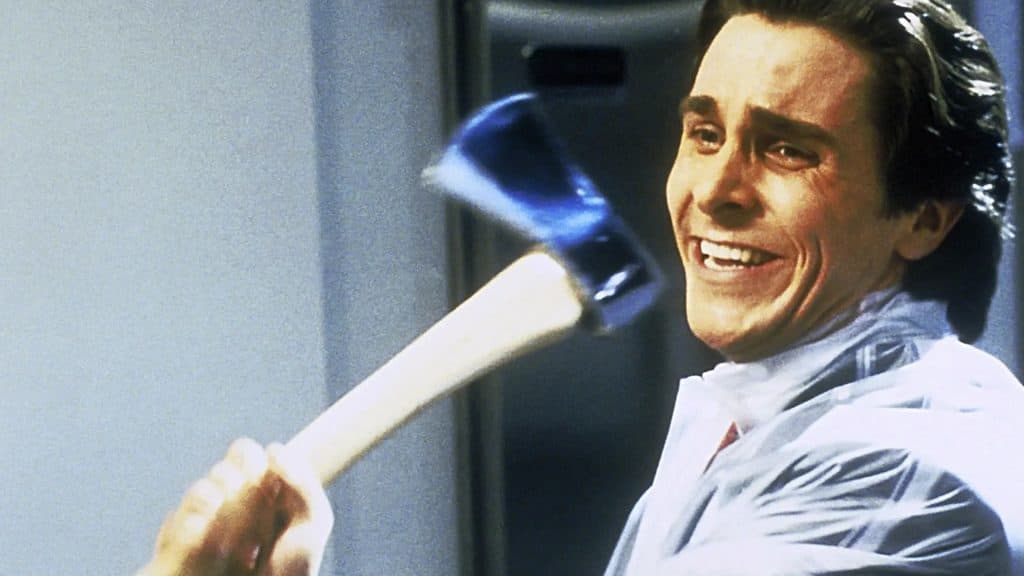 Patrick Bateman (Christian Bale) wields an axe in American Psycho