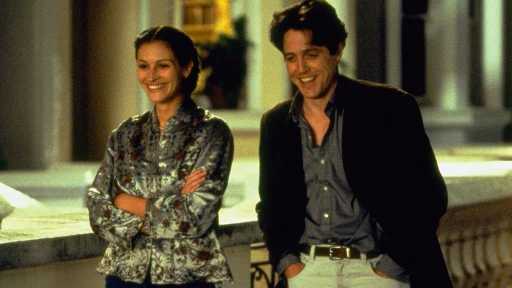 William (Hugh Grant) and Anna Scott (Julia Roberts) walk down the street in Notting Hill