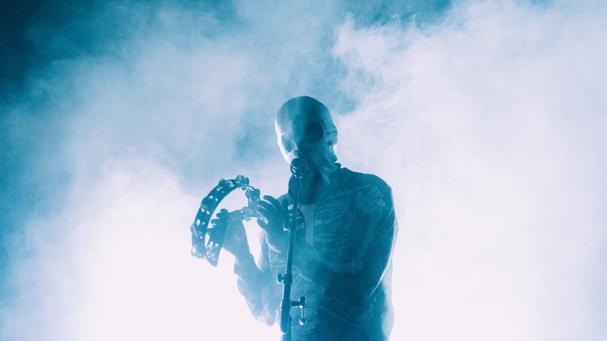 Tyler Josphe of Twenty One Pilots in a mask onstage