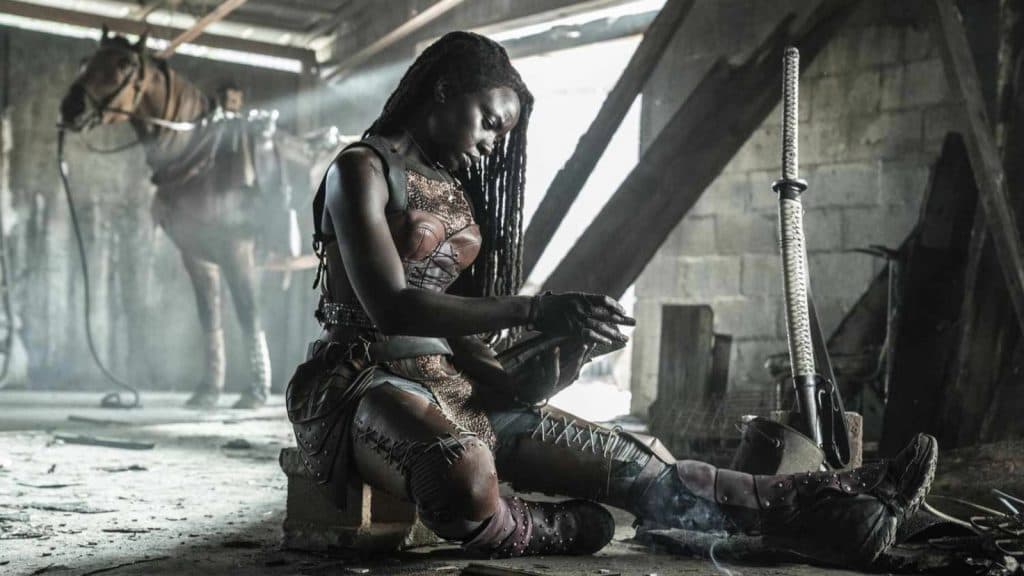 The Walking Dead: Michonne sits on the floor of an old warehouse