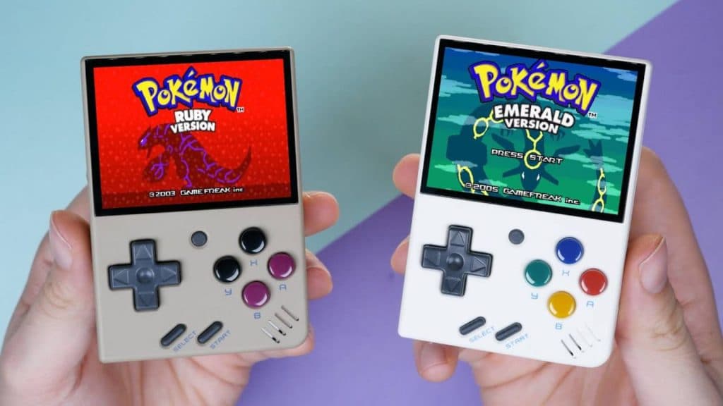 Two handheld consoles show Pokemon on their screens