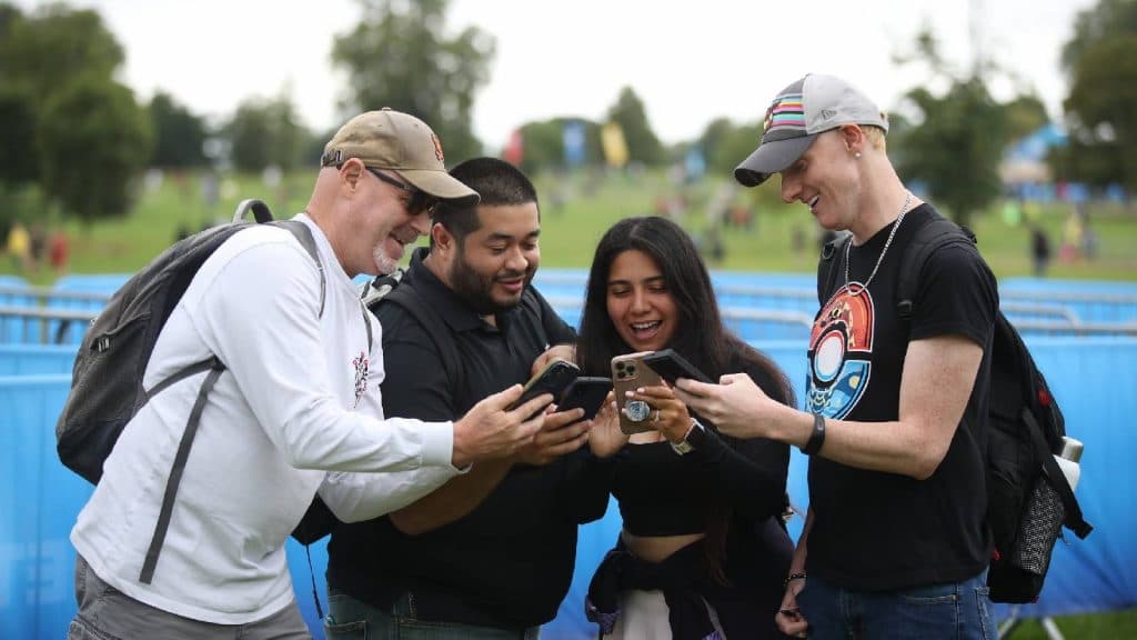 A photo shows several people playing Pokemon Go in a NYC park