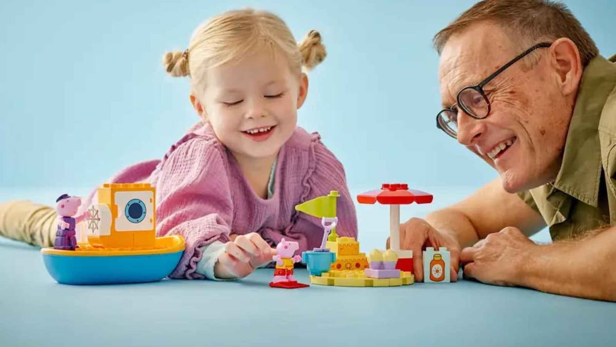 A child and adult with the The LEGO Duplo Peppa Pig Boat Trip set