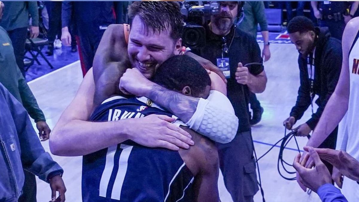 Luka Doncic and Kyrie Irving embrace as members of the Dallas Mavericks.