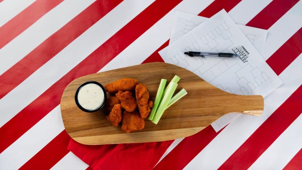 A photo of TGI Friday's wings with a brackets sheet.