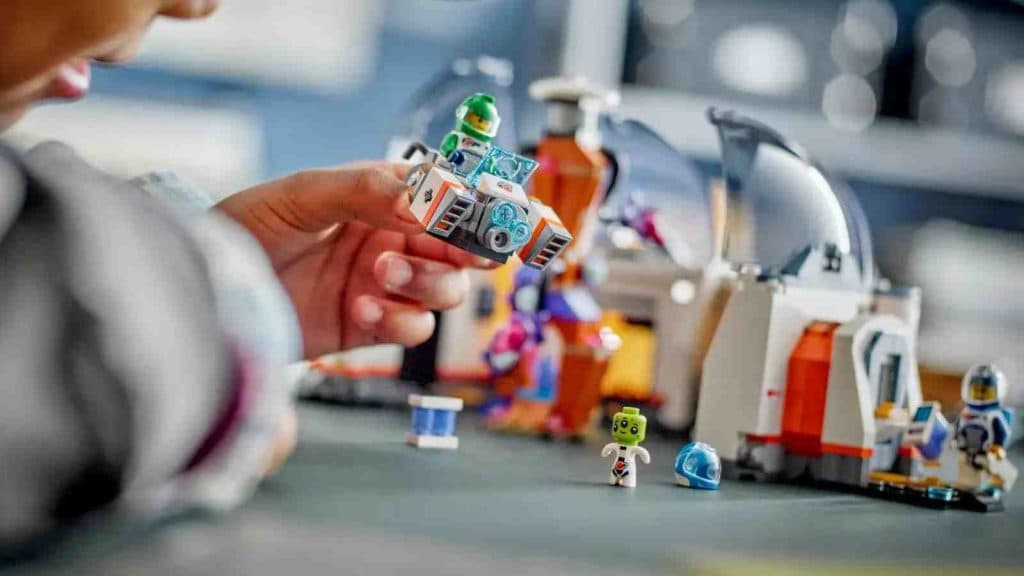 A child playing with their LEGO City Space Science Lab set