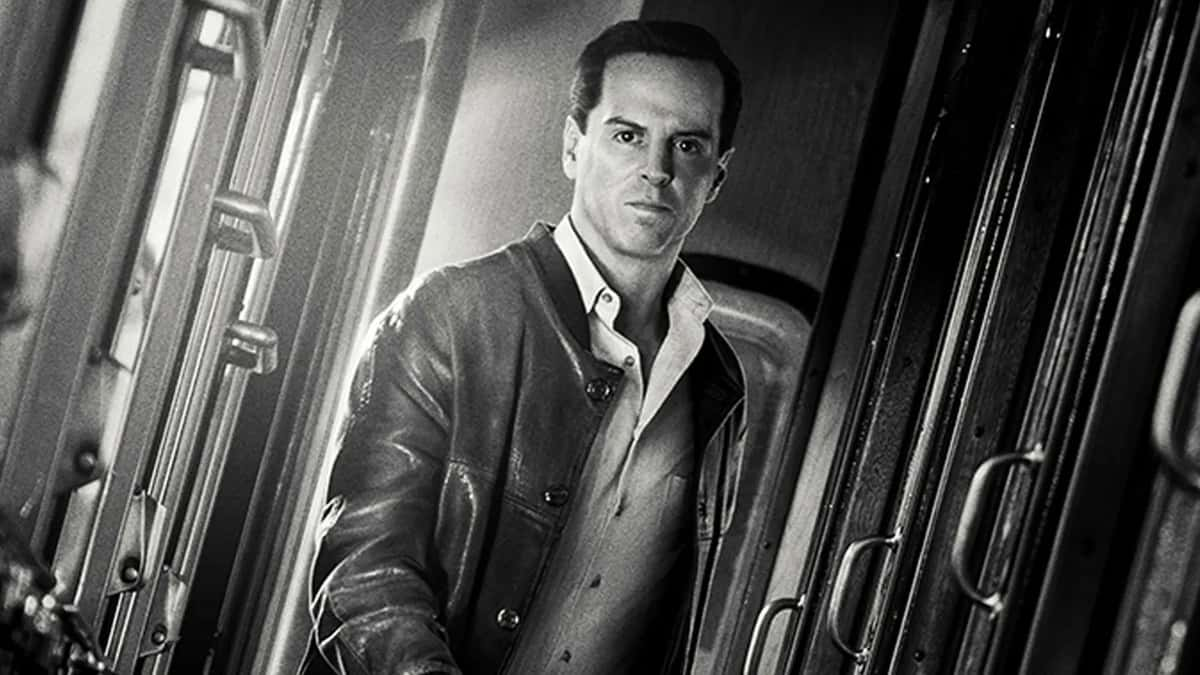 Andrew Scott as Tom Ripley on a train.