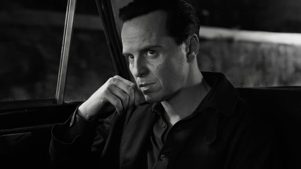 Andrew Scott, as Tom Ripley, sitting in a car.