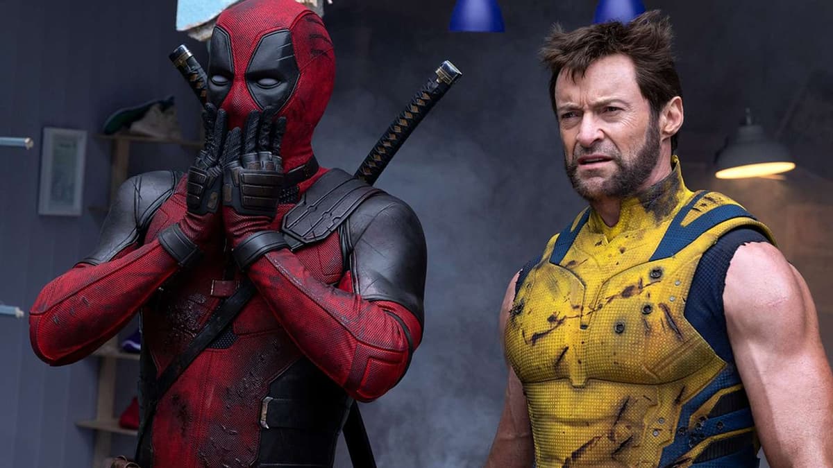 Deadpool is shocked while standing next to Wolverine.