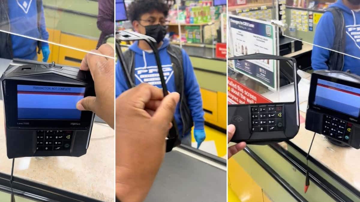 Man shows shop workers card skimmer on their card machine