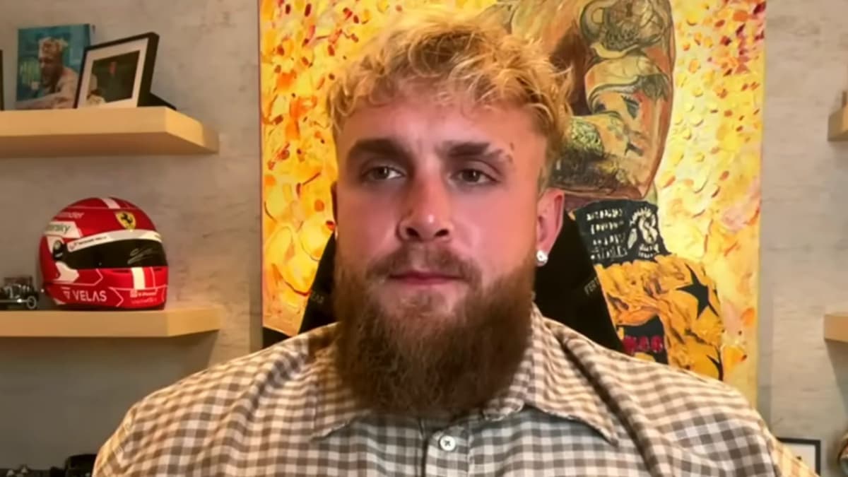 Jake Paul in brown shirt talking to camera