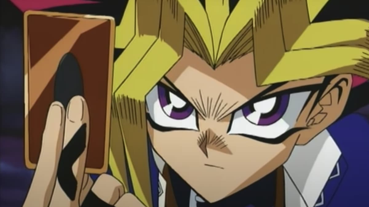 yugi plays card in yugioh