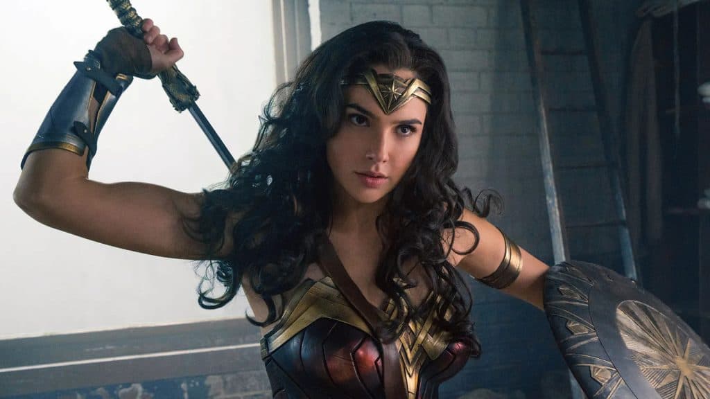 Gal Gadot as Wonder Woman draws her sword in Wonder Woman.