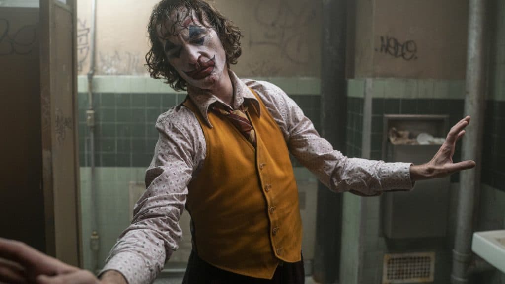 The Joker dances in a bathroom