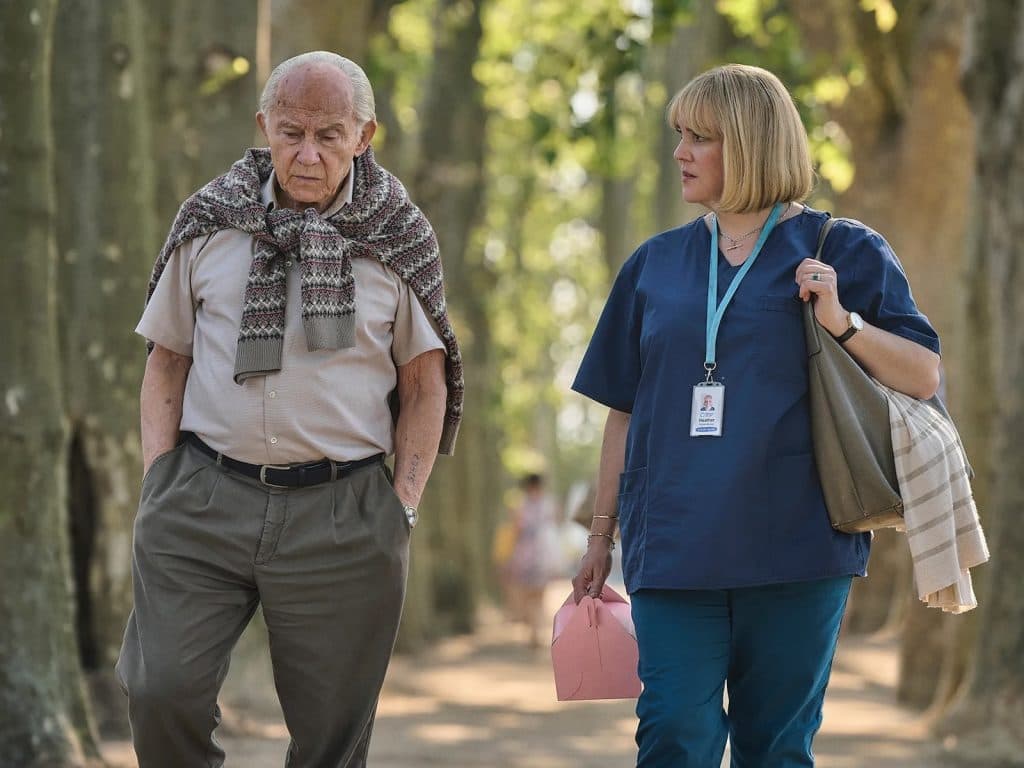 Harvey Keitel as Lali Sokolov and Melanie Lynskey as Heather Morris in The Tattooist of Auschwitz