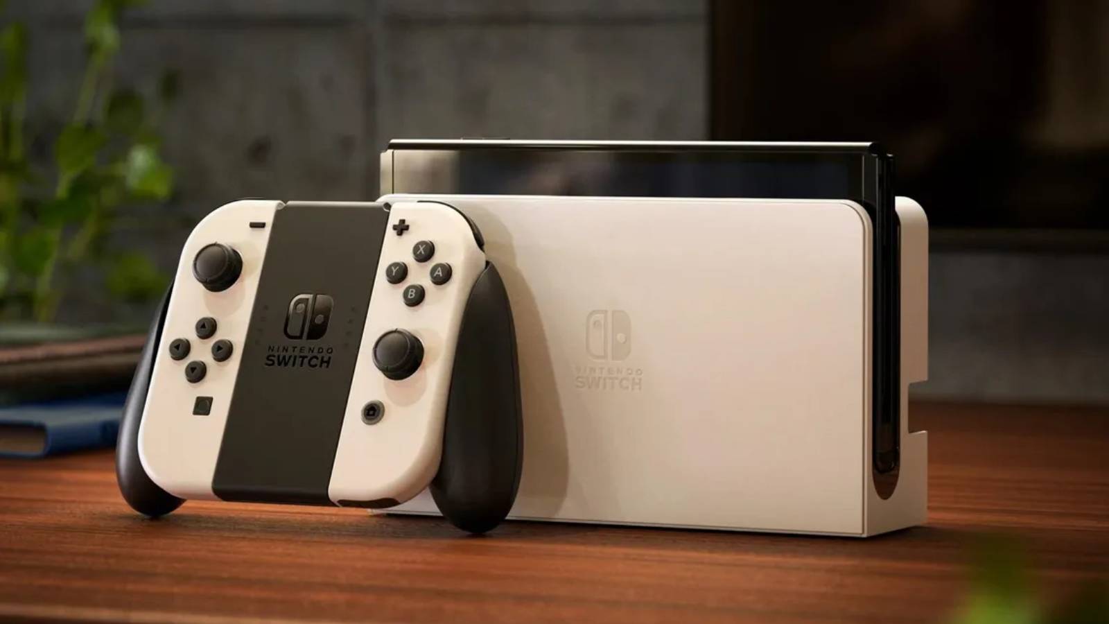 На снимке продукта изображена модель Nintendo Switch OLED и белая док-станция.