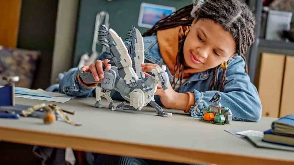 A child with their LEGO Harry Potter Buckbeak