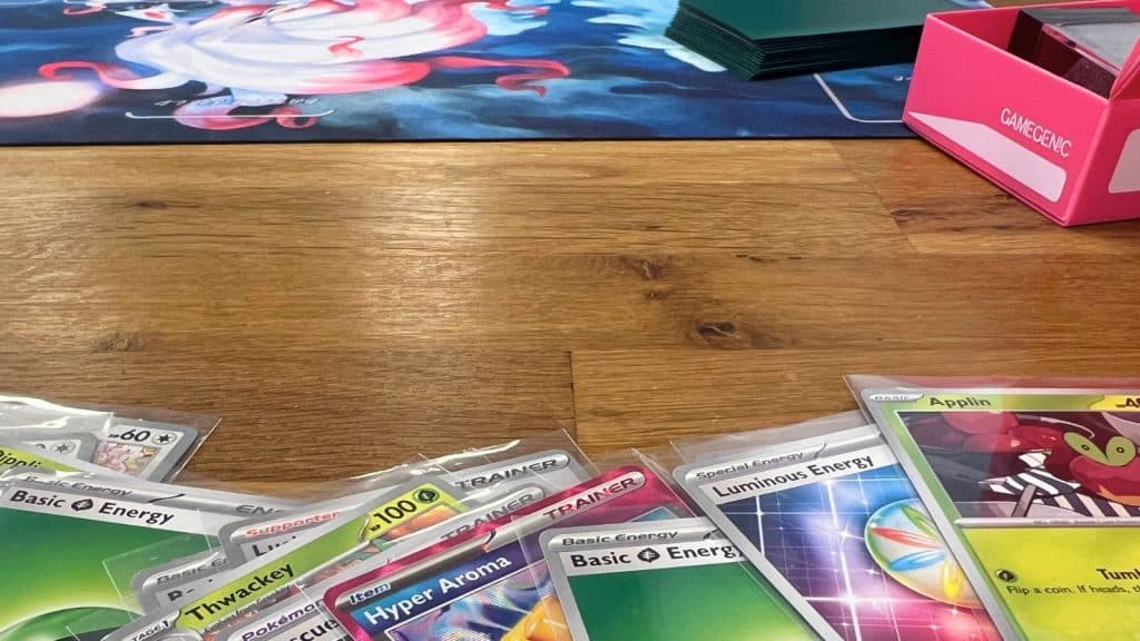 Pokemon cards and Zoroark playmat.