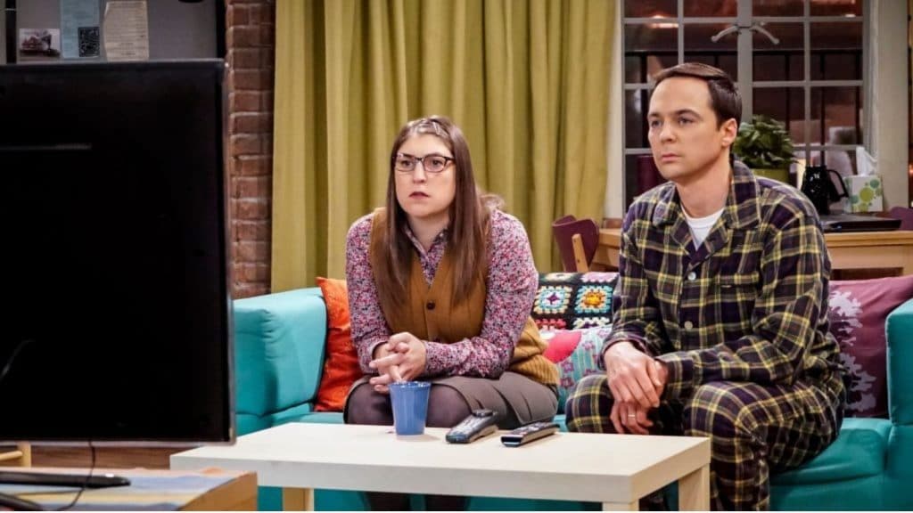 Amy and Sheldon watch TV in The Big Bang Theory